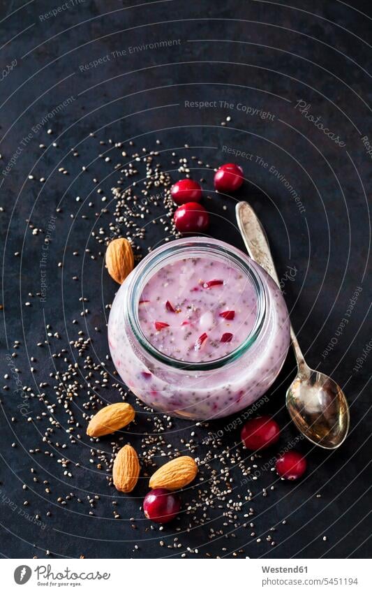 Dessert of chia seeds, almonds and cranberries Glass Glasses garnished ready to eat ready-to-eat fruity tea spoon Teaspoon tea spoons Cranberry Cranberries