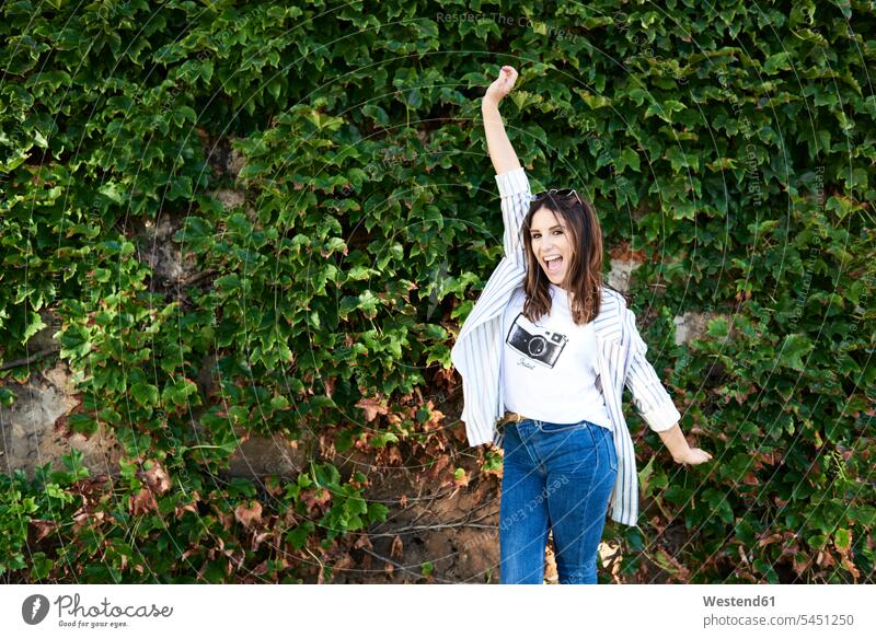 Portrait of young woman screaming for joy females women portrait portraits cry of joy Cries of joy shouting Adults grown-ups grownups adult people persons