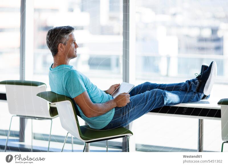 Guy Sitting Desk Feet Up Stock Photos - Free & Royalty-Free Stock