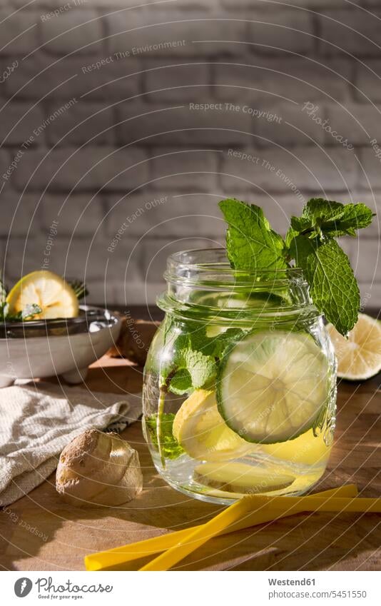 Glass of detox water with mint, ginger, rosmary and limes Bowl Bowls Lifestyles soft drink refreshing drink soft drinks refreshing drinks healthy eating