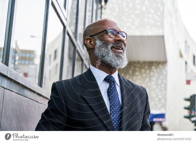 Portrait of a mature businessman Success successful smiling smile Businessman Business man Businessmen Business men content pleased portrait portraits amazement