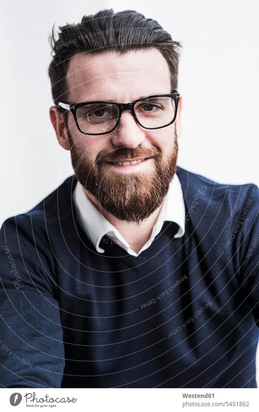 Portrait of a young businessman beard office offices office room office rooms Businessman Business man Businessmen Business men people persons human being