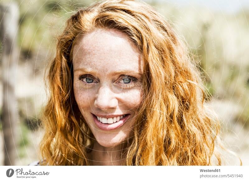 Portrait of smiling redheaded woman females women smile red hair red hairs red-haired portrait portraits Adults grown-ups grownups adult people persons