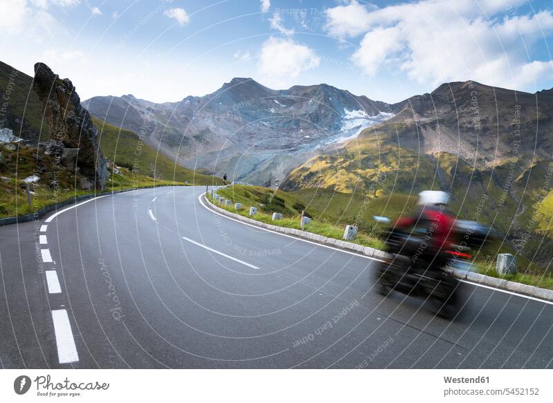 Austria, Salzburg State, biker on Grossglockner High Alpine Road Absence Absent nature natural world outdoors outdoor shots location shot location shots