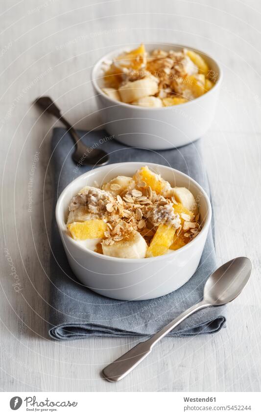 Bowl of granola with oat flakes, natural yoghurt, ananas and banana overhead view from above top view Overhead Overhead Shot View From Above nobody Pineapple