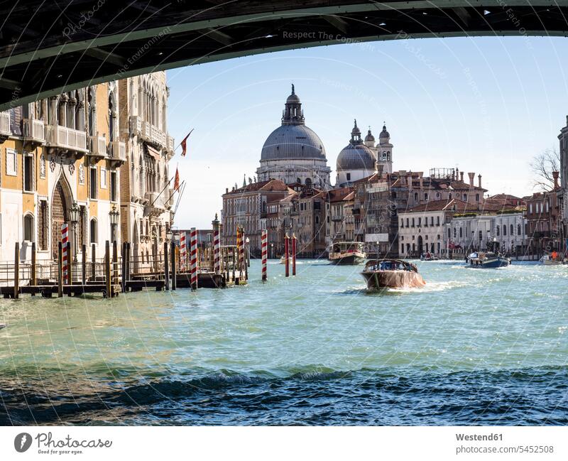 Italy, Venice, Canal Grande and Santa Maria della Salute church seen from boat vessel water vehicle boats bridge bridges driving drive Mobility mobile