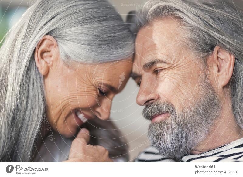 Portrait of an affectionate senior couple senior adults seniors old home at home happiness happy together twosomes partnership couples Adults grown-ups grownups
