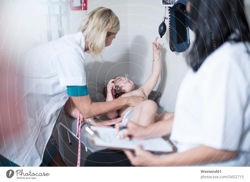 Little girl at examination at the pedeatrician females girls pediatrician paediatricians child children kid kids people persons human being humans human beings