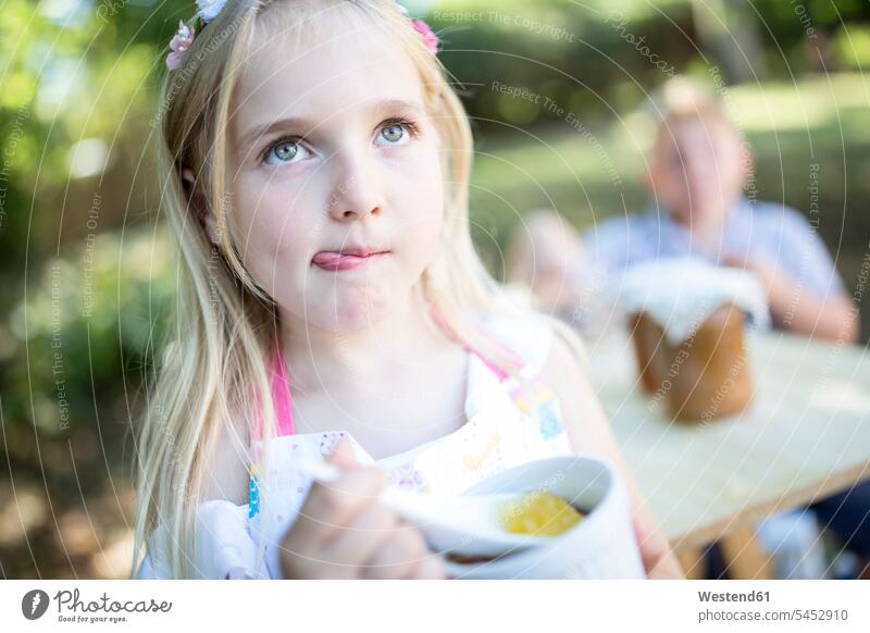 Girl eating jelly outdoors girl females girls child children kid kids people persons human being humans human beings Jelly Jello Pudding Puddings Sweet Food