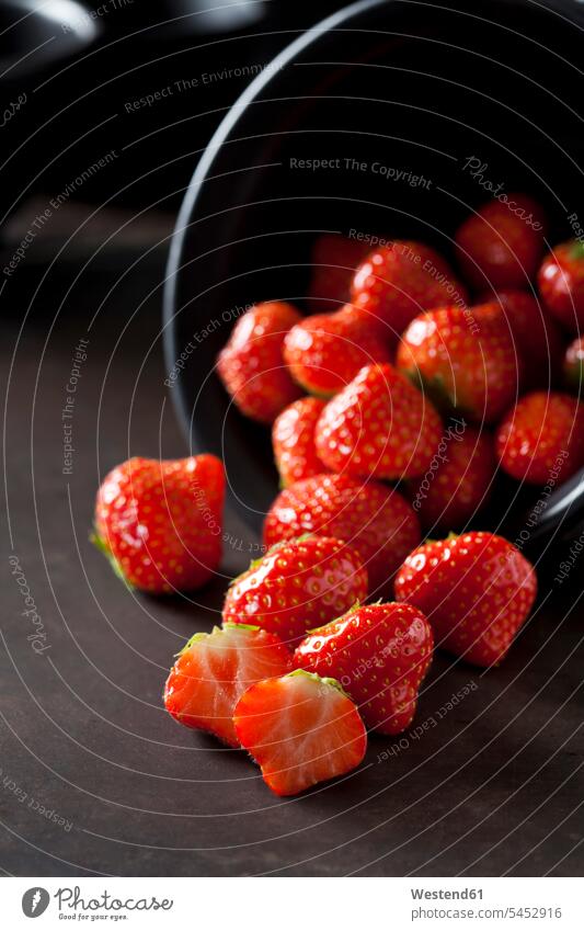 Sliced and whole strawberries Bowl Bowls sliced gleaming healthy eating nutrition copy space focus on foreground Focus In The Foreground focus on the foreground