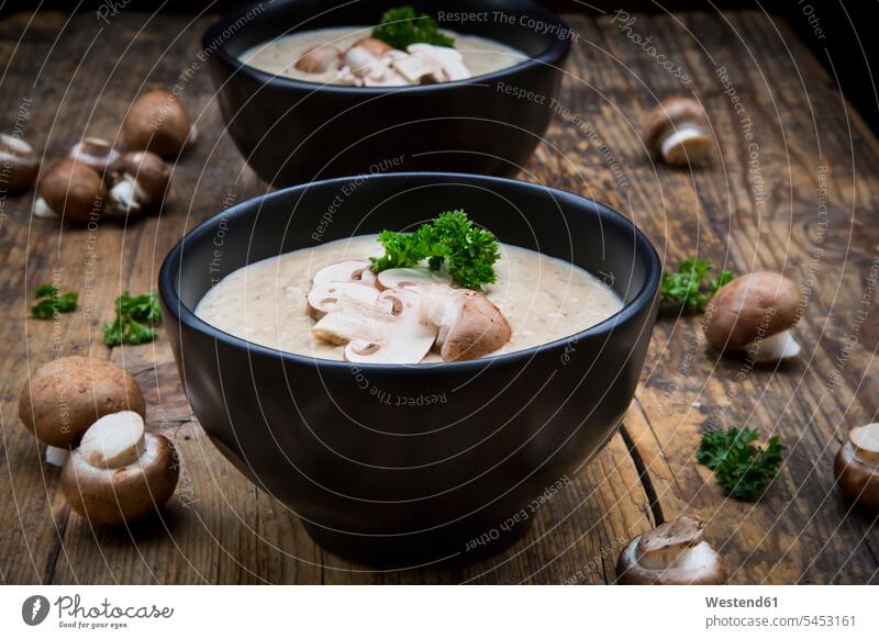 Creme of mushroom soup Brown Background brown ready to eat ready-to-eat parsley mashed puréed healthy eating nutrition focus on foreground