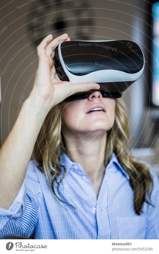 Woman wearing VR glasses virtual reality woman females women specs Eye Glasses spectacles Eyeglasses Adults grown-ups grownups adult people persons human being