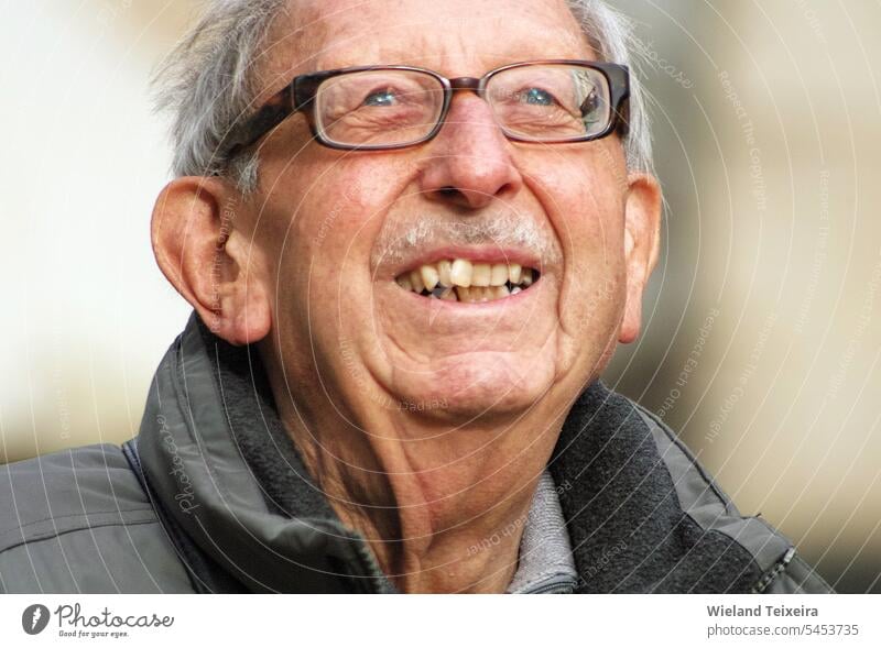 Portrait of a 81 year old happy man with glasses outdoor hair aged closeup people male friendly look german caucasian portrait eyes head face happiness adult