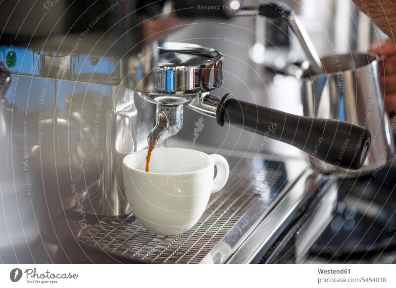 Coffee from espresso machine pouring into cup Cup Cups cafe Drink beverages Drinks Beverage food and drink Nutrition Alimentation Food and Drinks
