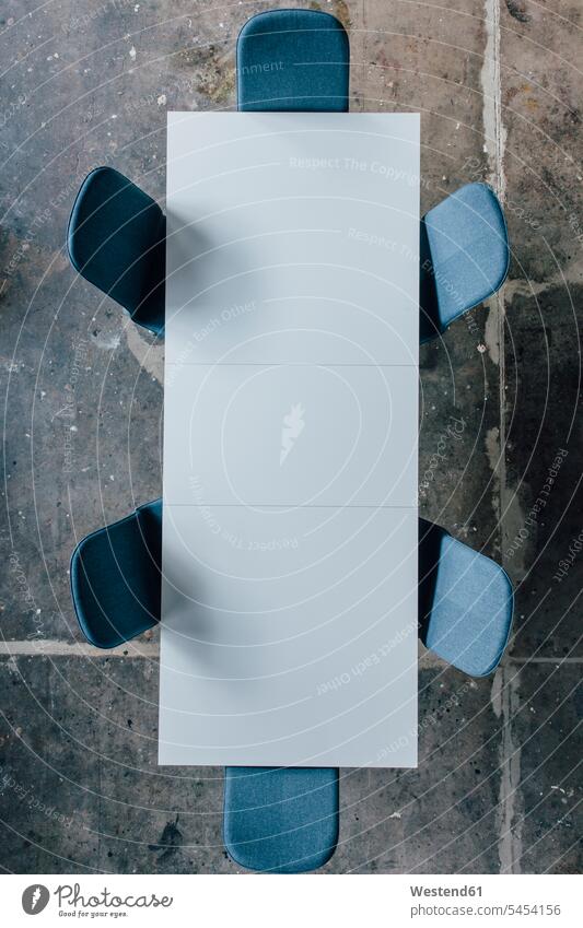 Conference table seen from above yellow teamwork teamworking simplicity simple Absence Absent empty emptiness interior design interior designing concrete floor