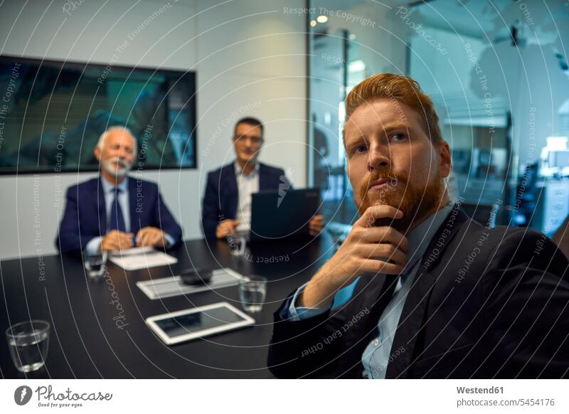 Portrait of businessman turning round in a meeting office offices office room office rooms Business Meeting business conference Businessman Business man