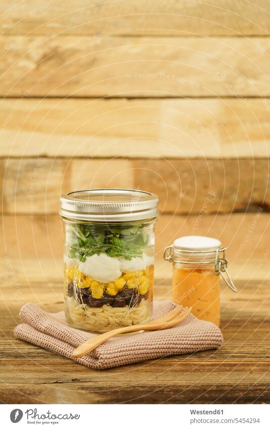 Jar of vegetarian mixed salad with Kritharaki, corn, rocket and cranberries and jar of cocktail sauce Salad Dressing ready to eat ready-to-eat Cocktail Sauce