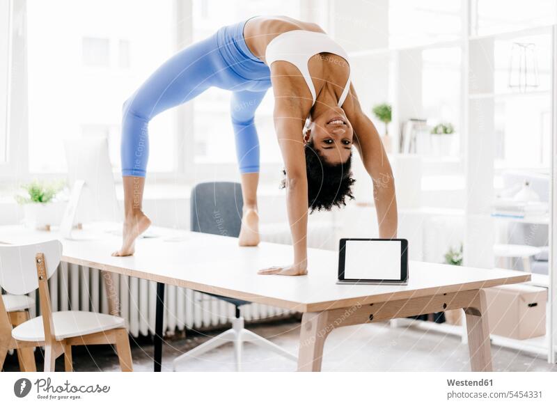 Young woman practising yoga with laptop by her side fit Laptop Computers laptops notebook training Sport Training learning practicing practice practise exercise