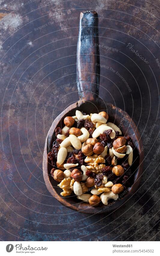 Wooden spoon of trail mix brown copy space healthy eating nutrition variation rustic many plenty large group of objects many objects munchies nibbles raisin