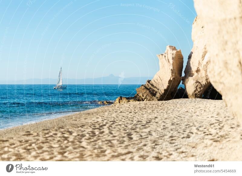 Italy, Calabria, Tropea, Tyrrhenian Sea, cave at beach, sandstone rock and sailing boat coast coastline coast area Seacoast seaside cavern caves caverns