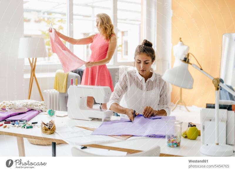 A Young Fashion Designer Girl Works in a Tailor& X27;s Room