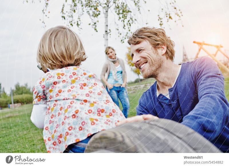 Family on playground daughter daughters happiness happy family families Fun having fun funny play yard play ground playgrounds child children people persons