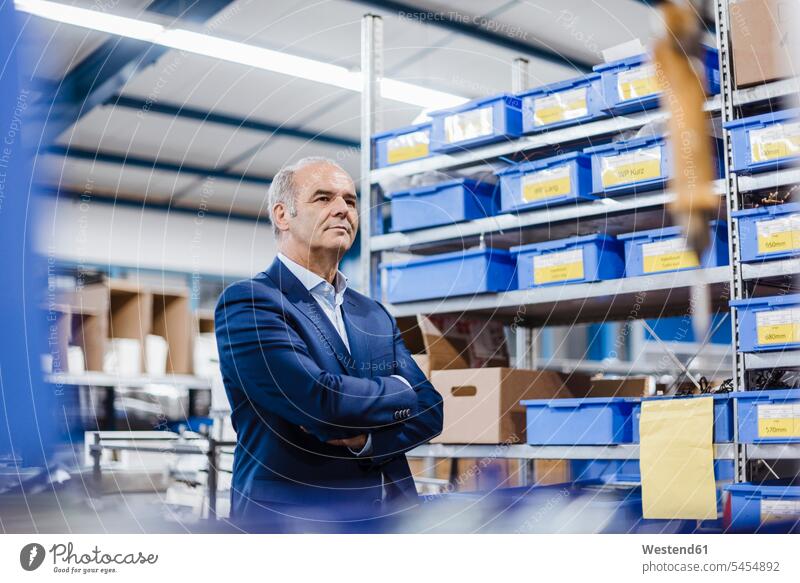 Business founder standing in his company with arms crossed, portrait firm Arms Folded Folded Arms Crossed Arms Crossing Arms Arms Clasped Self-confidence