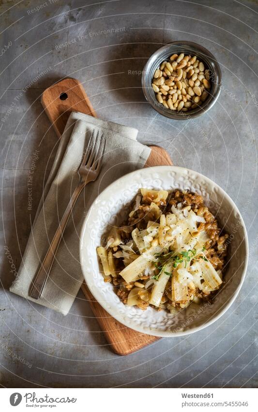 Spelt risotto with salsifies, pine nuts and parmesan food and drink Nutrition Alimentation Food and Drinks healthy eating nutrition folded Fork Forks napkin
