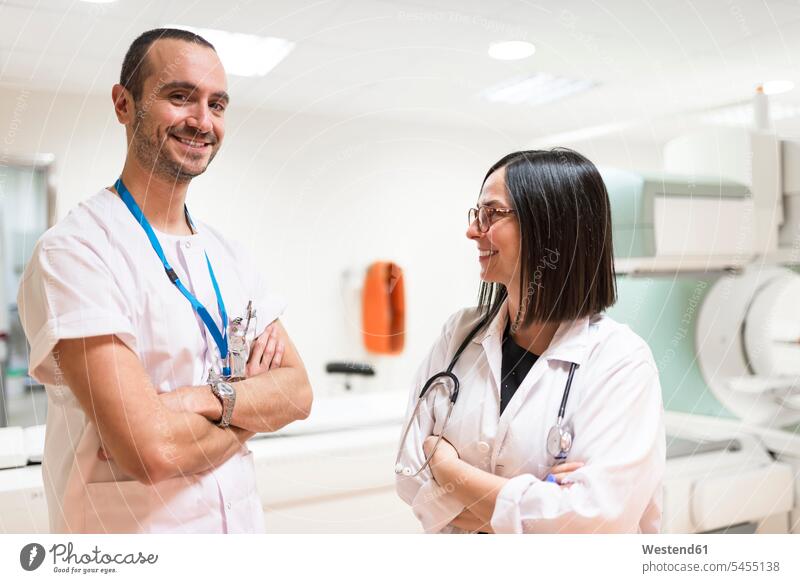 Portrait of two smiling doctors Female Doctor physicians Female Doctors portrait portraits nurse orderly male nurse smile healthcare and medicine medical