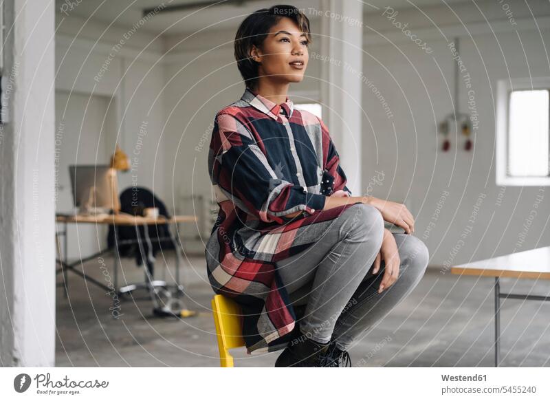 Woman sitting on chair thinking businesswoman businesswomen business woman business women chairs females business people businesspeople business world