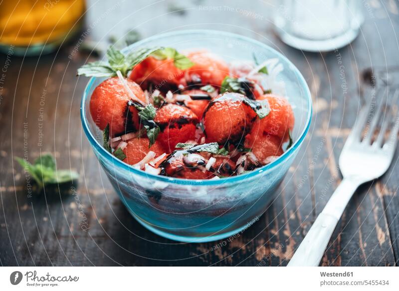 Watermelon salad with eschalot, mint, olive oil and balsamico in bowl food and drink Nutrition Alimentation Food and Drinks Salad Salads wooden sphere ball