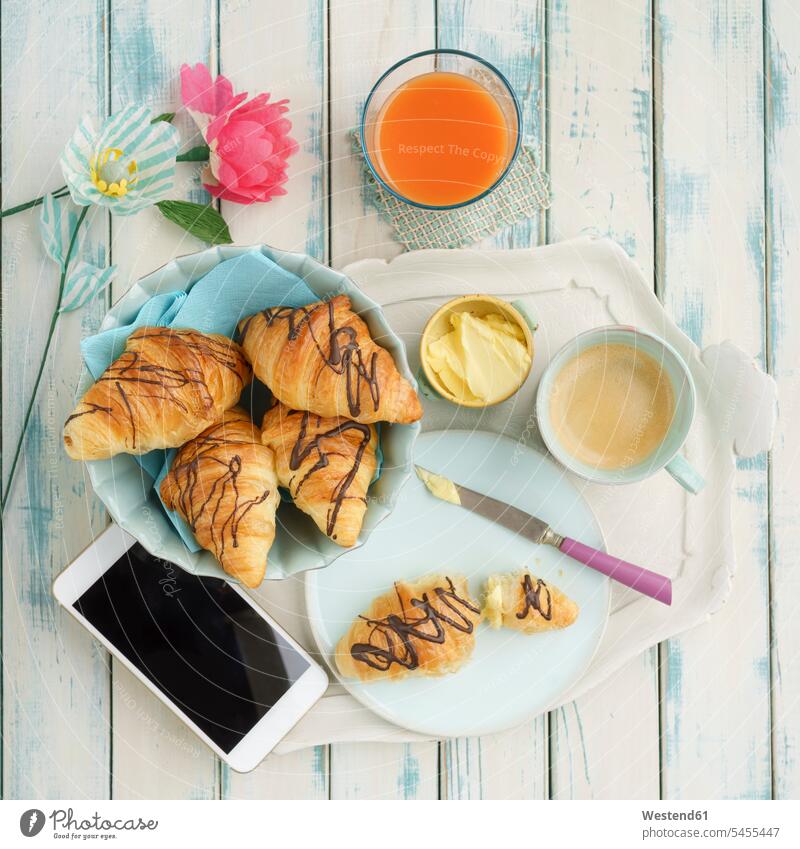 Breakfast with chocolate croissants and smartphone food and drink Nutrition Alimentation Food and Drinks technology technologies Technological Smartphone iPhone