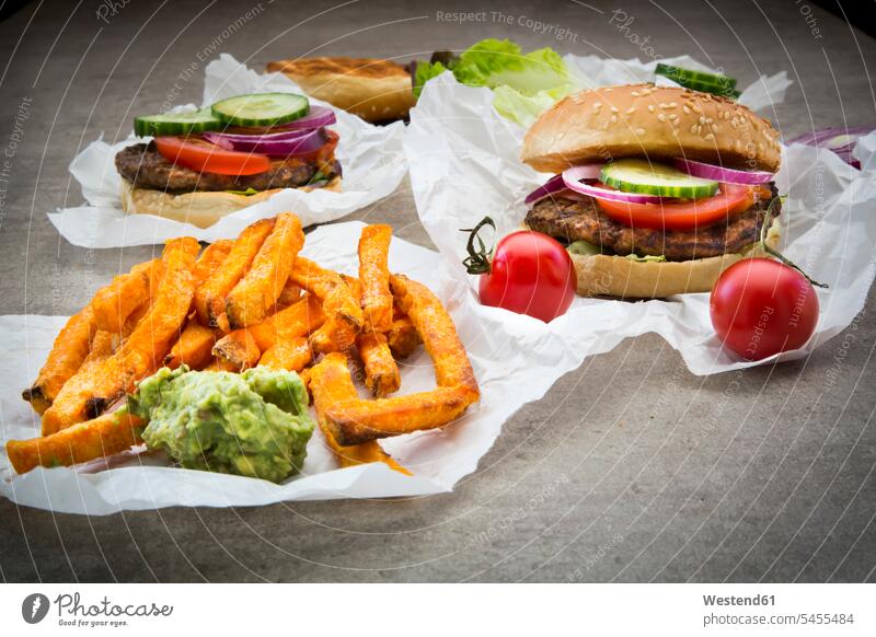 Homemade burger with sweet potato fries and avocado dip food and drink Nutrition Alimentation Food and Drinks Avocado Avocados Persea americana sesame