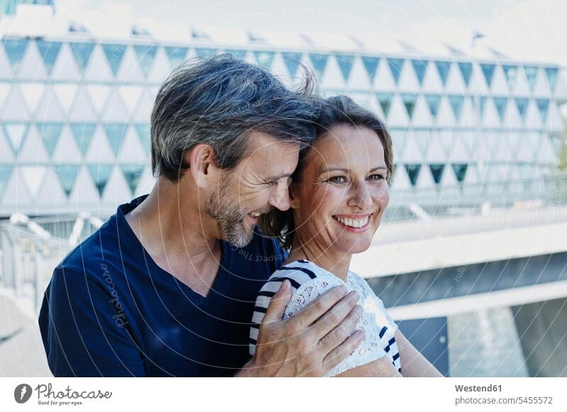 Portrait of happy mature couple outdoors Love loving smiling smile twosomes partnership couples portrait portraits positive Emotion Feeling Feelings Sentiments