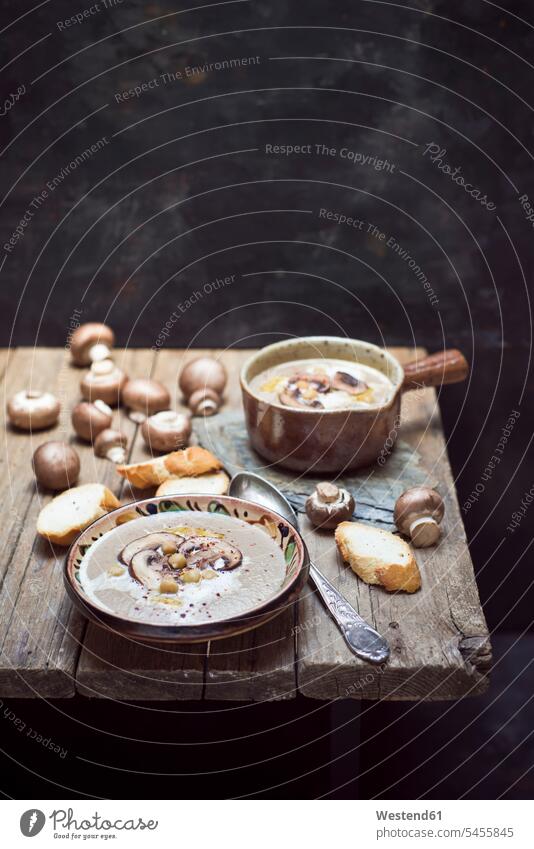 Creme of mushroom soup with chick peas Cooking Pot Pots Cooking Pots wooden rustic hearty savoury food lusty garnished sliced ready to eat ready-to-eat