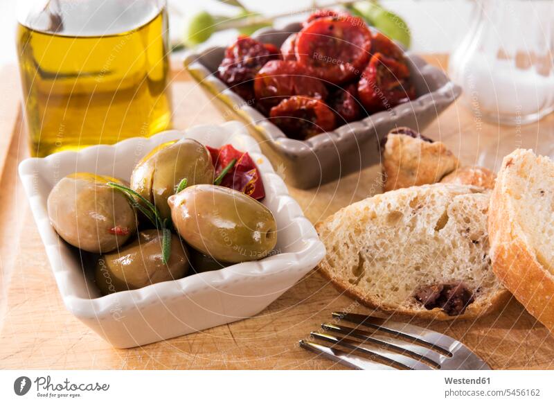 antipasti, pickled olives, pickled tried tomato, olive bread, olive oil and salt food and drink Nutrition Alimentation Food and Drinks Snack Snacks Snack Food