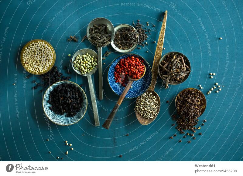 Various sorts of pepper Bowl Bowls White Peppercorn white pepper White Peppercorns various different blue background blue backgrounds divers pink peppercorn