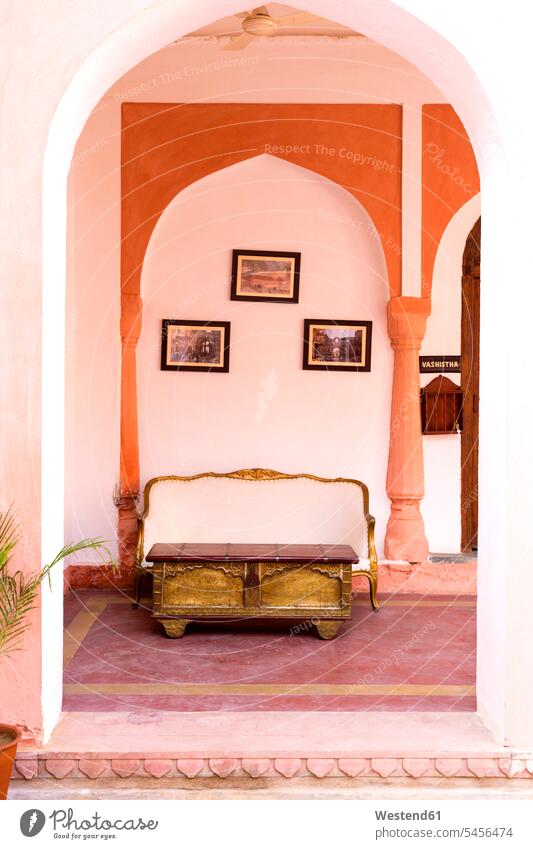 India, Rajasthan, Alwar, Heritage Hotel Ram Bihari Palace, Sofa and old table chest Coffer passage gateway outdoors outdoor shots location shot location shots