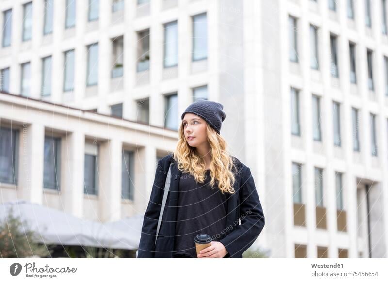 Portrait of young woman with coffee to go in autumn fall Coffee to Go takeaway coffee females women portrait portraits takeaway drink Drink beverages Drinks