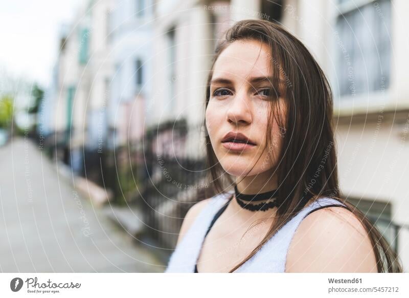 Portrait of teenage girl in the city Teenage Girls female teenagers town cities towns portrait portraits Teenager Teens people persons human being humans