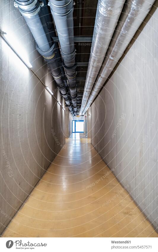 Pipes over empty corridor inside factory, Stuttgart, Germany indoors indoor shot indoor shots interior interior view Interiors Diminishing Perspective distance