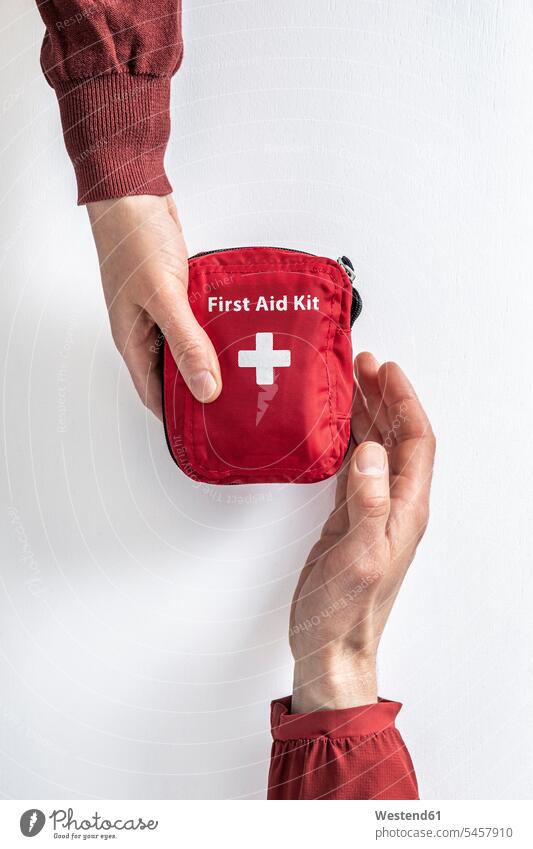 Overhead view of woman handing over first aid kit to man touristic tourists give travel traveling colour colours Ideas plan planned planning departing leaving