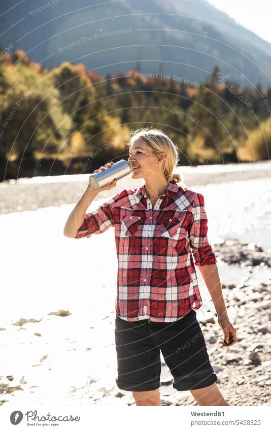 Austria, Alps, woman on a hiking trip having a break at a brook caucasian caucasian appearance caucasian ethnicity european White - Caucasian mature woman