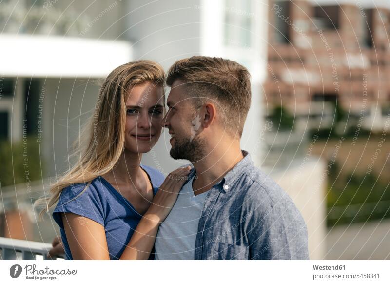 Netherlands, Maastricht, affectionate young couple in the city Affection Affectionate town cities towns twosomes partnership couples outdoors outdoor shots
