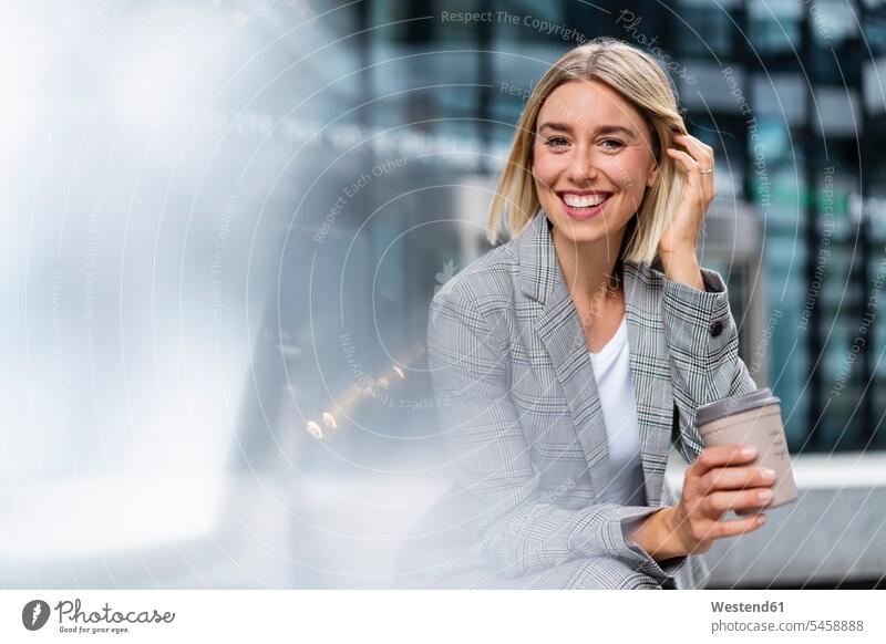 Portrait of happy young businesswoman with takeaway coffee in the city business life business world business person businesspeople business woman business women