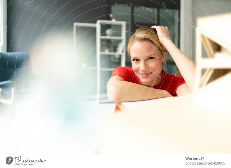 Portrait of smiling young woman in office with architectural model on desk Occupation Work job jobs profession professional occupation business life