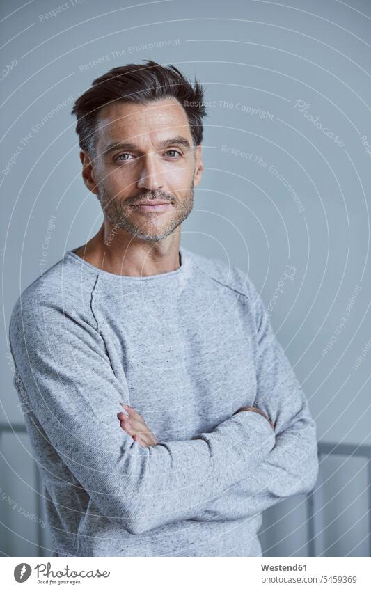 Portrait of man with stubble wearing grey sweatshirt gray men males Sweatshirt Unshaven portrait portraits colour colours Adults grown-ups grownups adult people