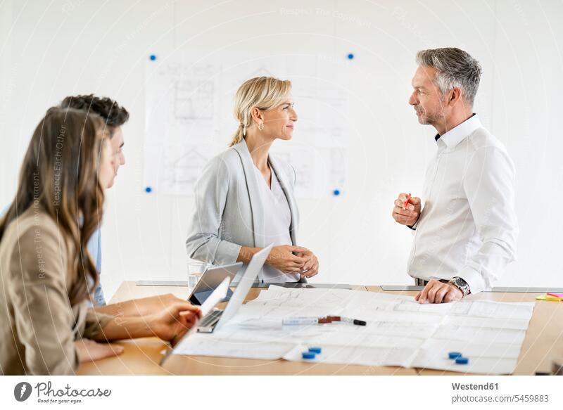 Senior businessman and woman leading workshop in office human human being human beings humans person persons caucasian appearance caucasian ethnicity european