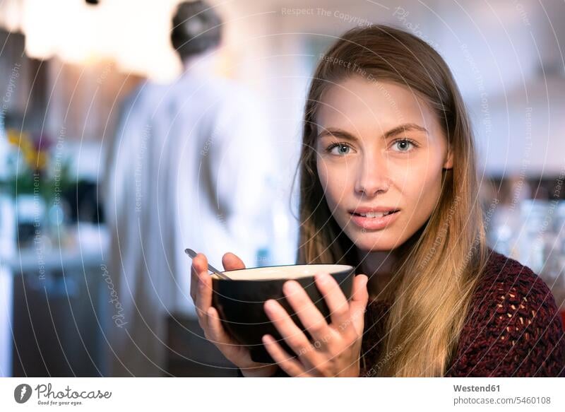 Portrait of blond woman holding bowl females women portrait portraits blond hair blonde hair Adults grown-ups grownups adult people persons human being humans