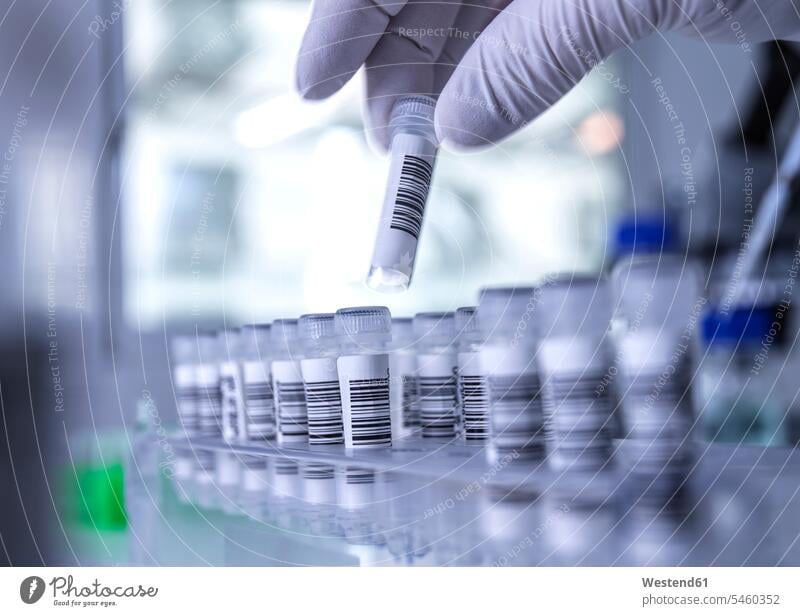 Hand of scientist wearing protective glove handling human saliva samples in laboratory gloves Progress Part Of partial view cropped cropped image